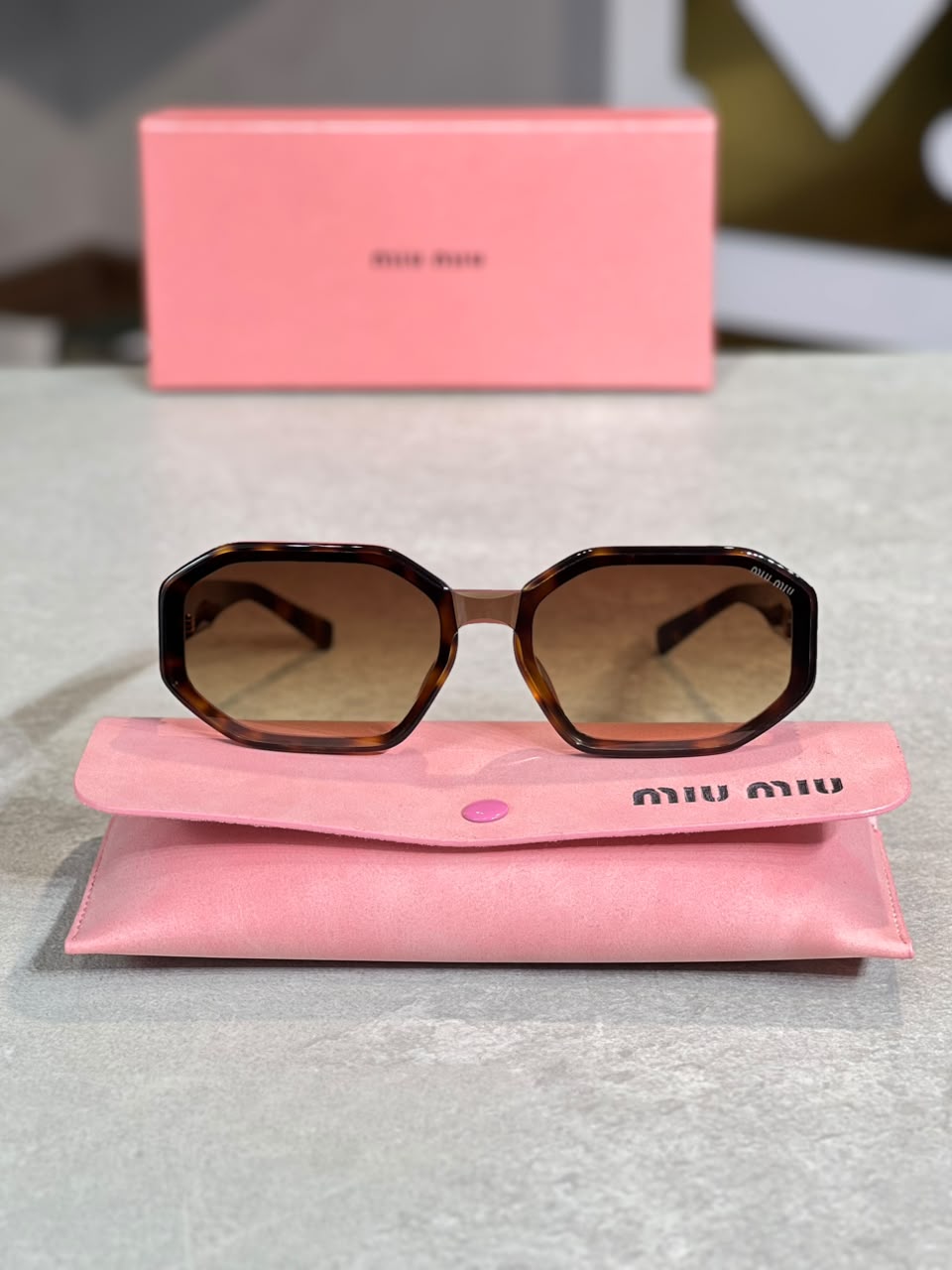 Gafas Miu Miu carey rectangular con estuche