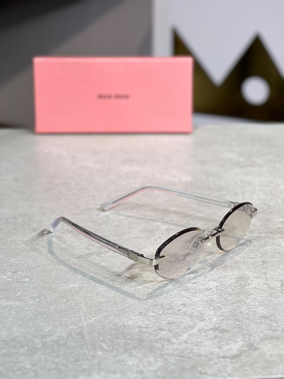 Gafas Miu Miu ovalada dorada transparente