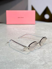 Gafas Miu Miu ovalada dorada transparente