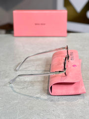 Gafas Miu Miu ovalada dorada transparente