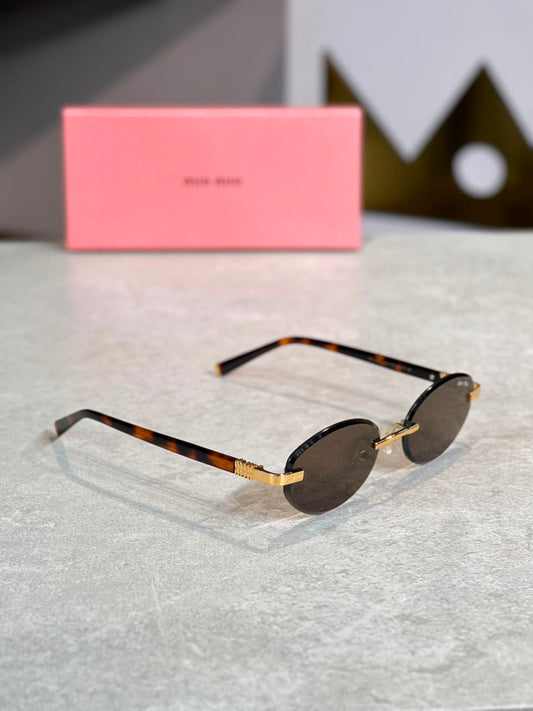 Gafas Miu Miu ovalada carey humo