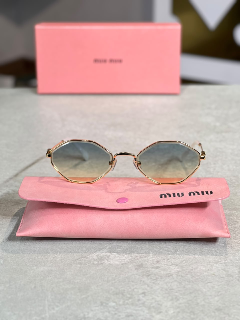Gafas Miu Miu ovalada ambar