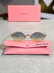 Gafas Miu Miu ovalada ambar