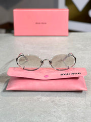 Gafas Miu Miu Ovalada Plateada Transparente