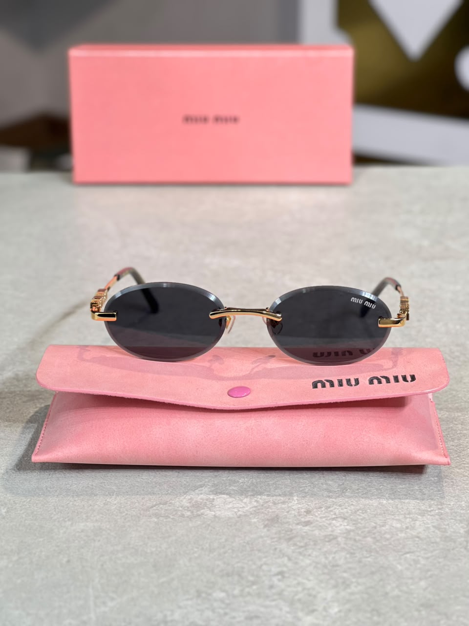 Gafas Miu Miu Ovalada Gris Humo